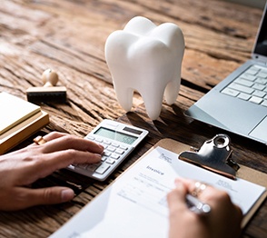 A patient filling out a dental insurance form