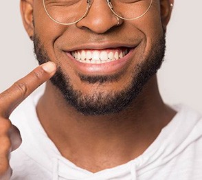 Man pointing at his teeth