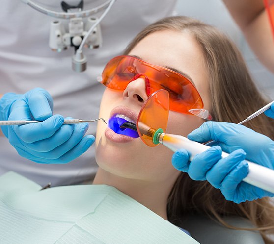 Woman having a tooth-colored filling put in place