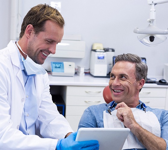 Man smiling at dentist