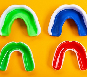 Four colorful mouthguards