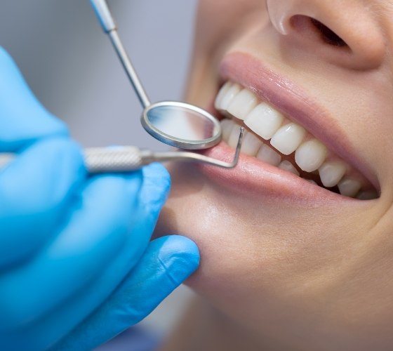 Patient receiving scaling and root planing periodontal therapy