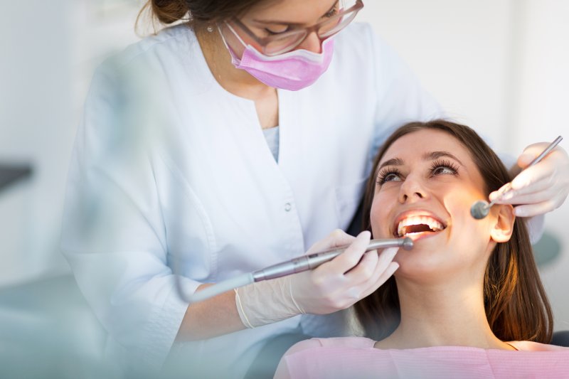 patient smiling during routine dental checkups in Austin