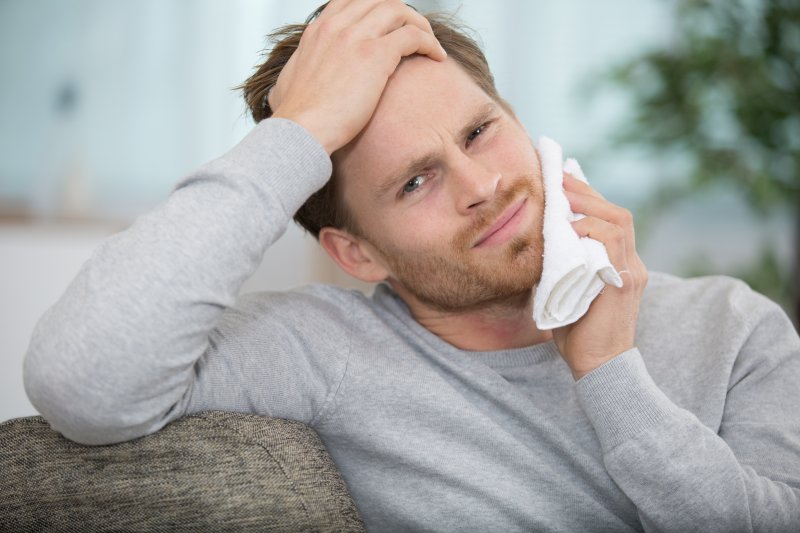 man hurting from a toothache in Austin