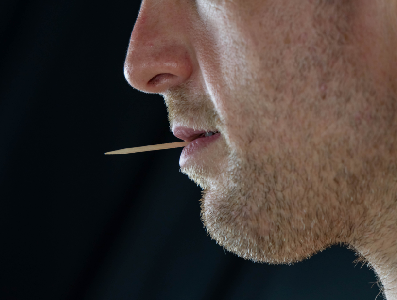 Man with toothpick in mouth